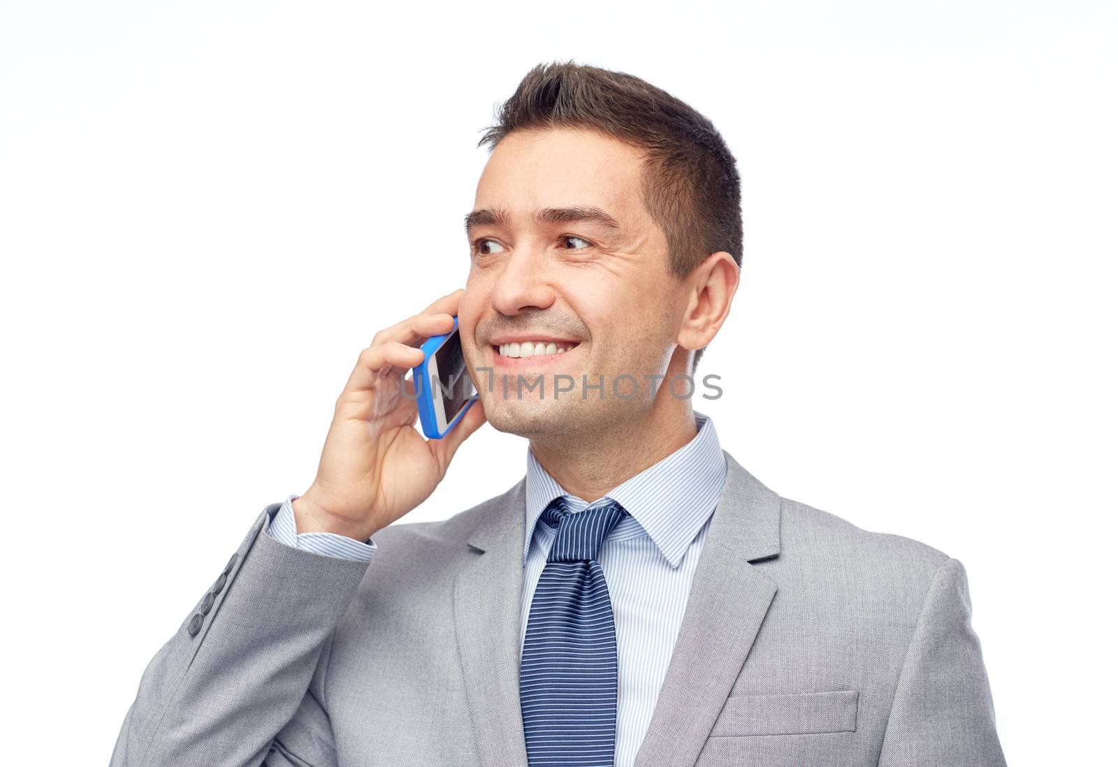 happy businessman calling on smartphone by dolgachov