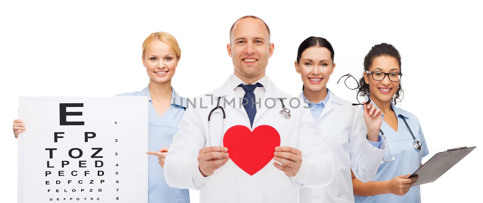 group of smiling doctors with red heart shape by dolgachov
