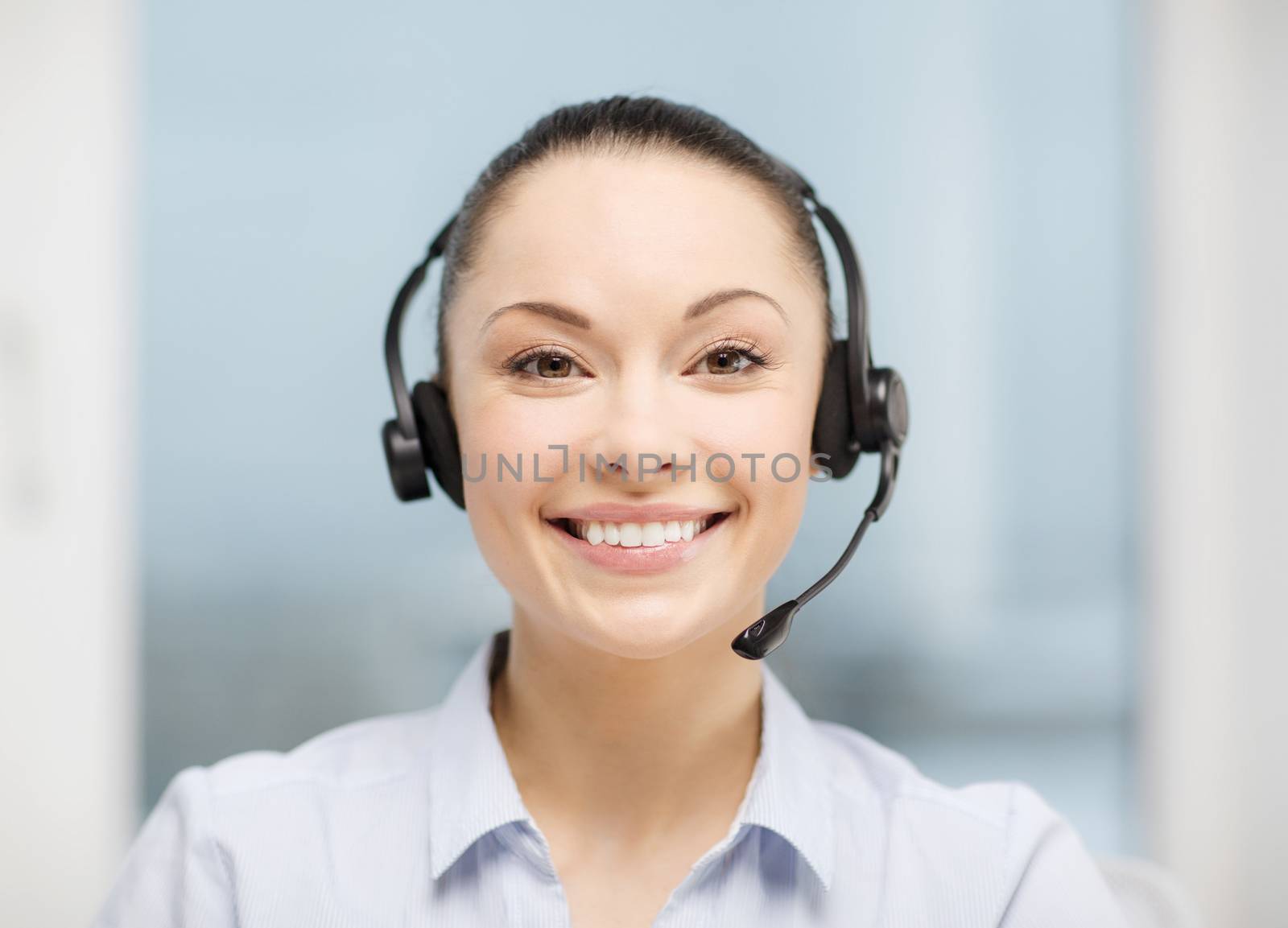 business, communication and call center concept - female helpline operator with headphones