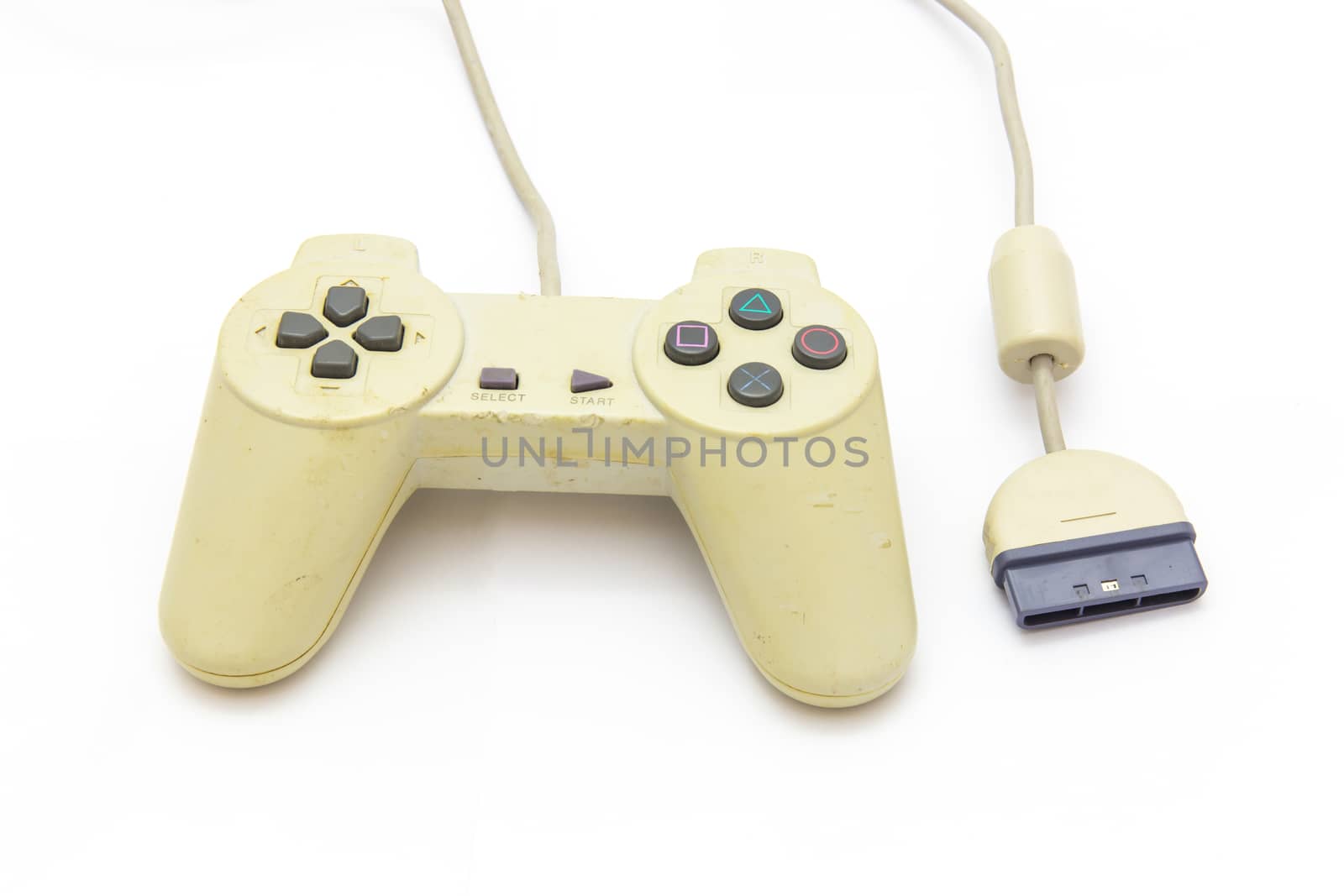 Old white joystick with port connect on the white background. video game controller
