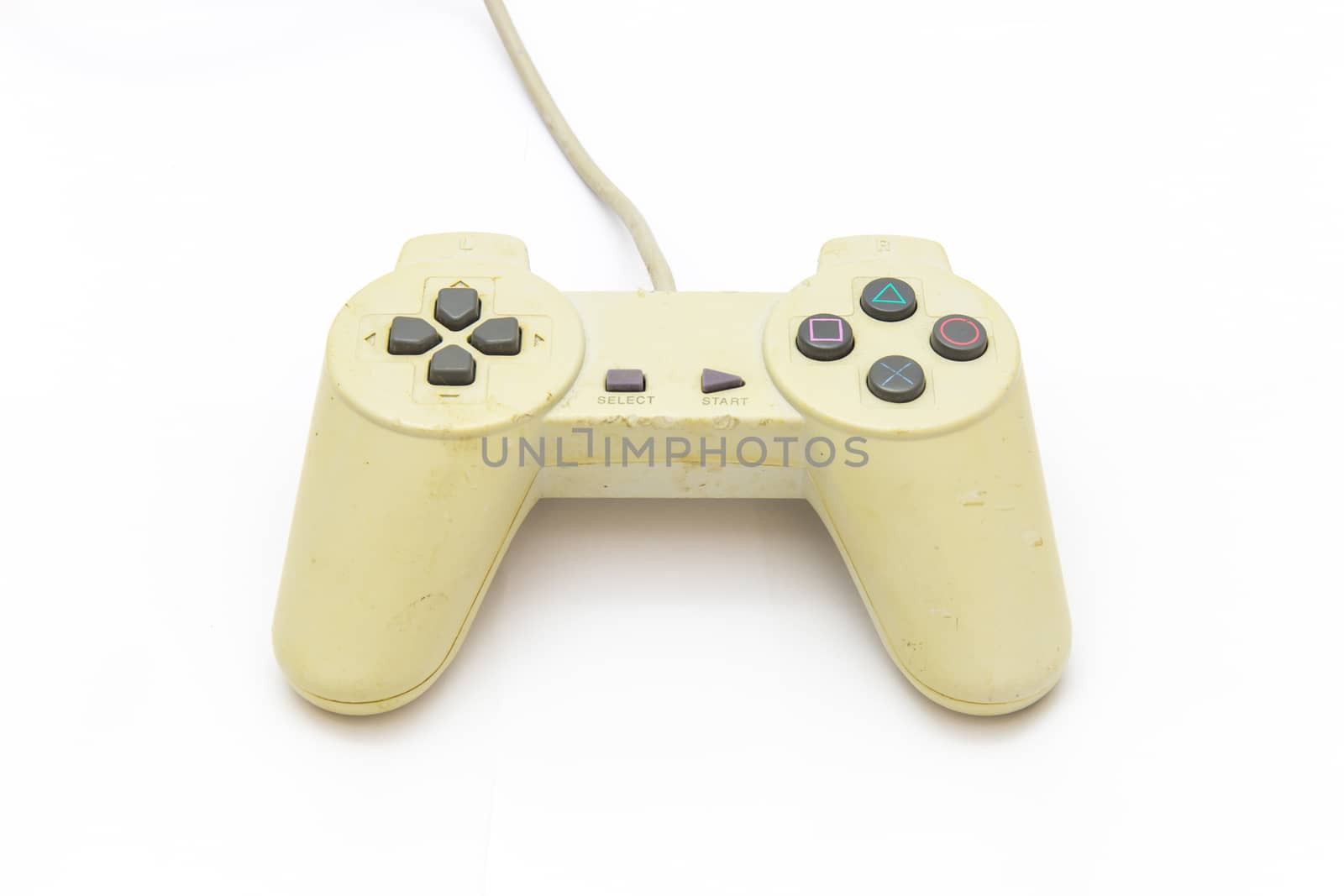 Old white joystick on the white background. video game controller