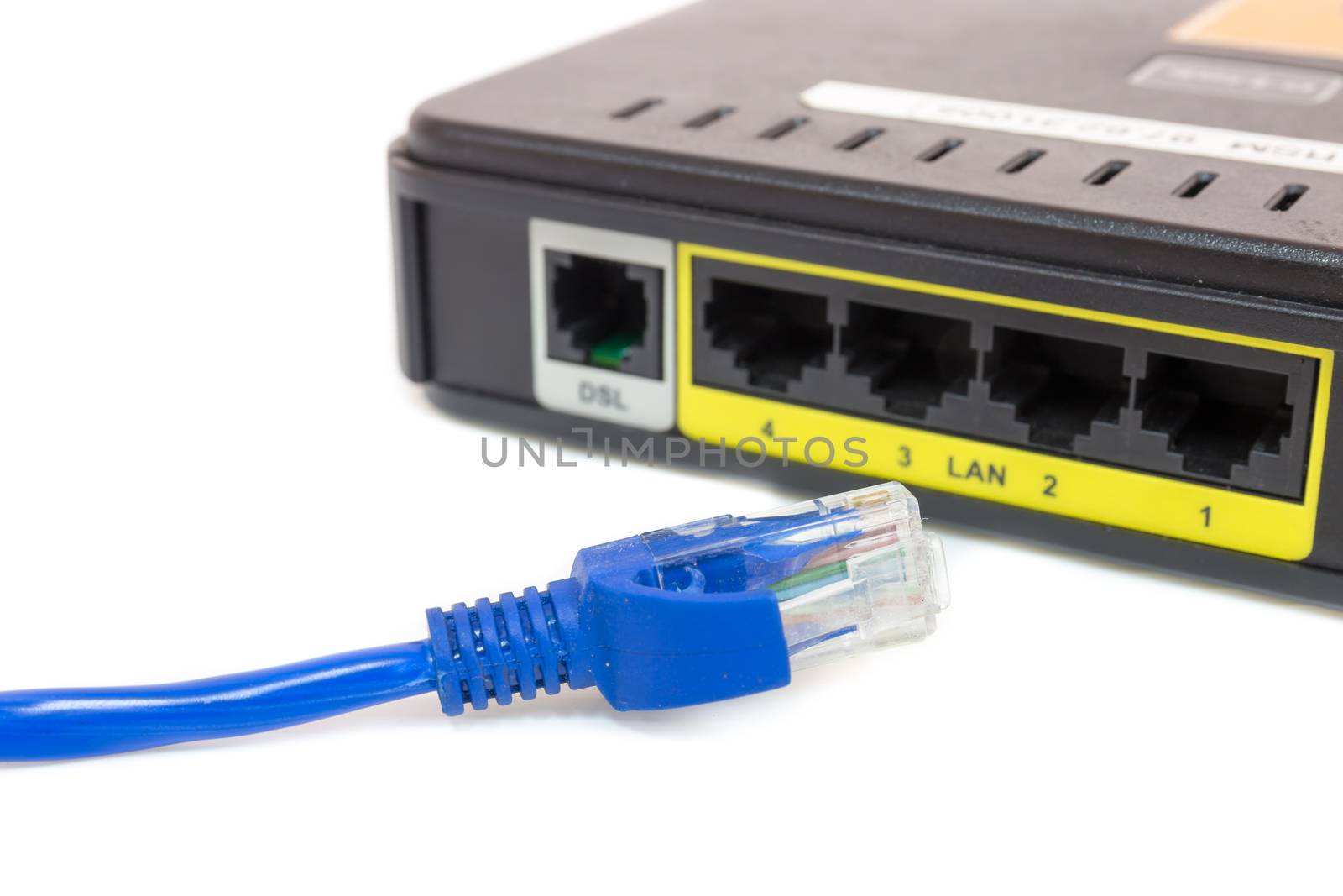 Close up LAN UTP RJ45 Cat5e In front of ADSL Router network switch by powerbeephoto