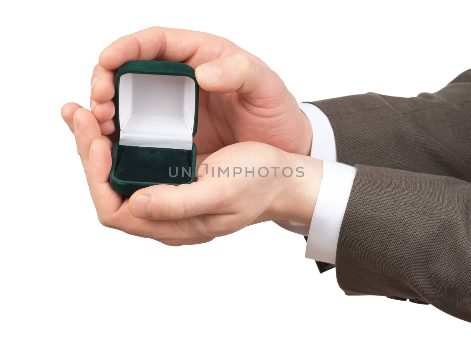Open empty ring box in businessmans hands on isolated white background