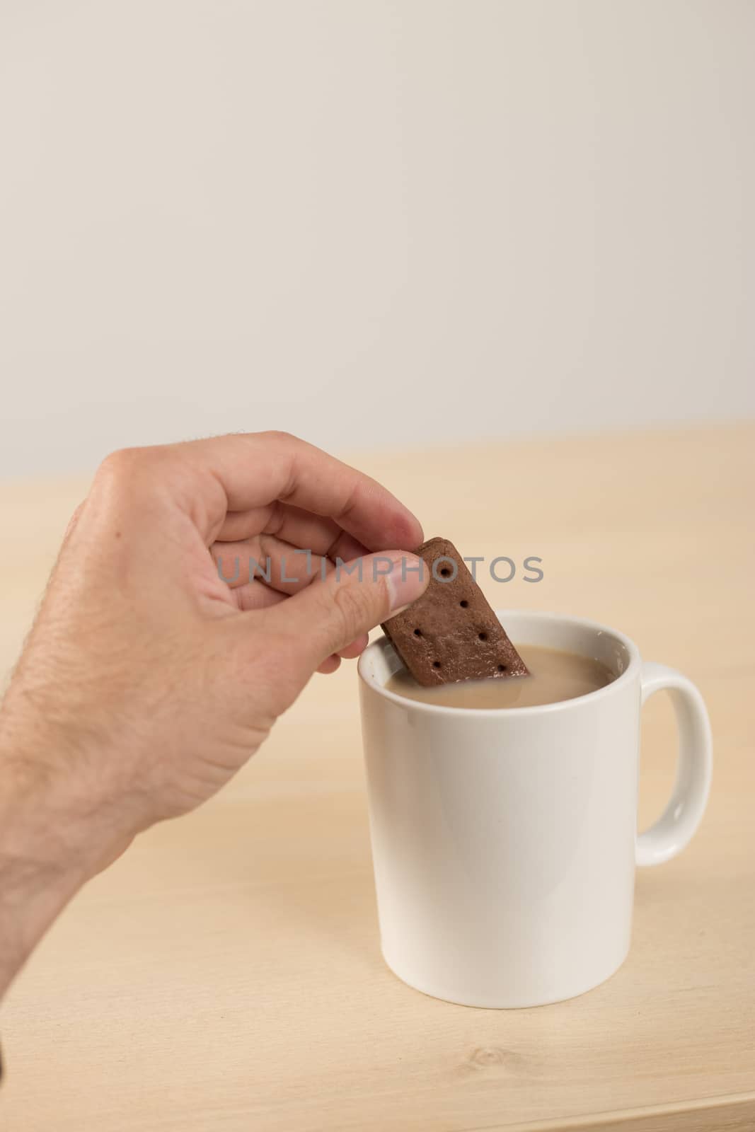 dunking biscuit in tea