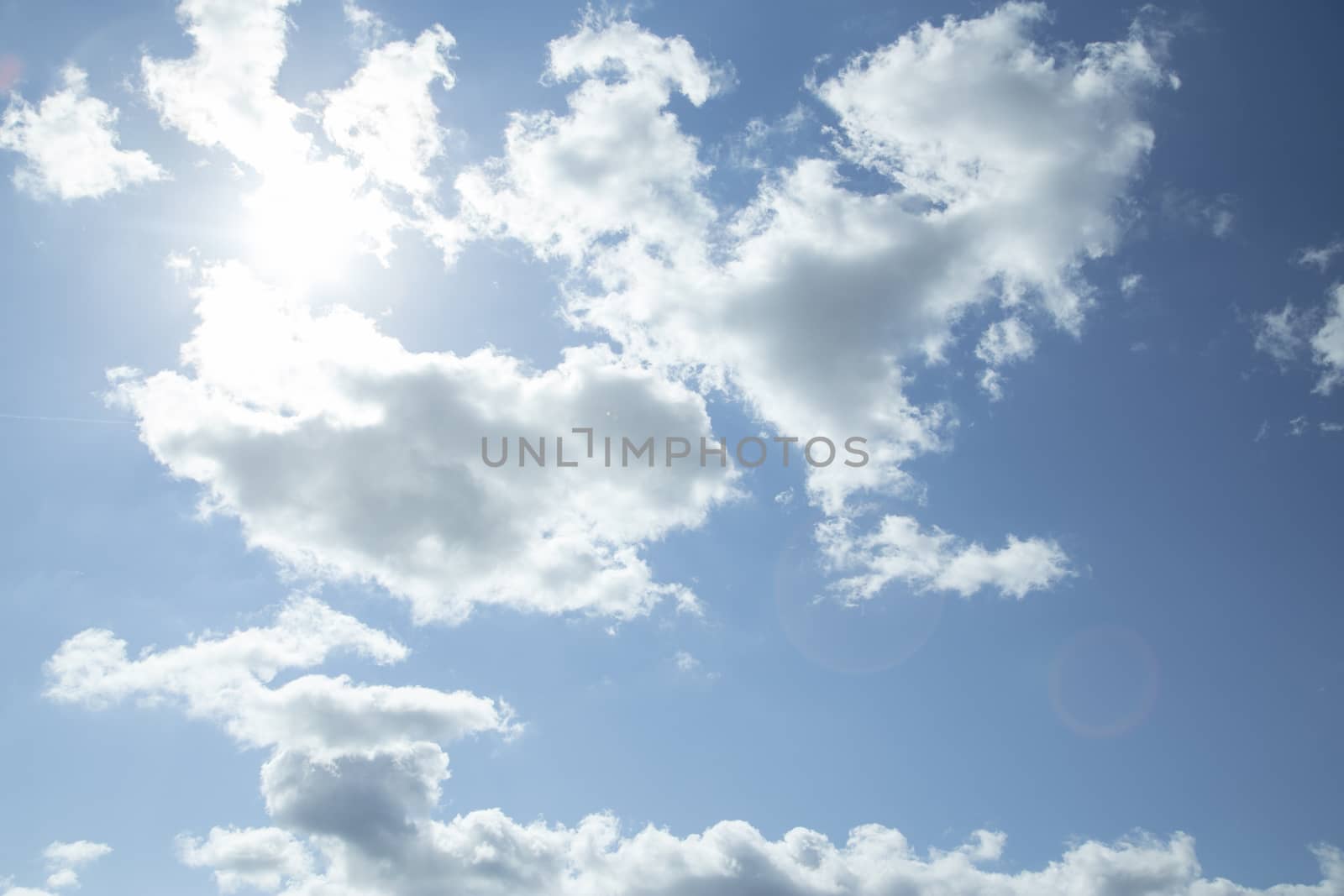 Clouds in the sky with lens flare