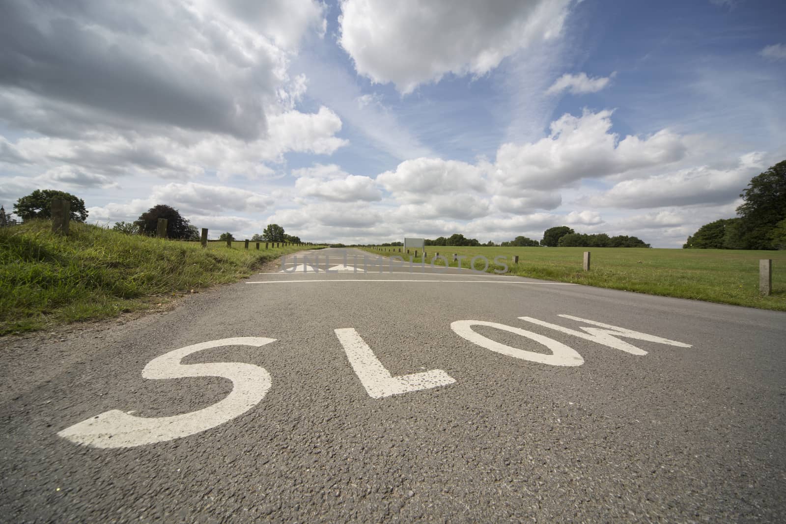 SLOW, UK road marking