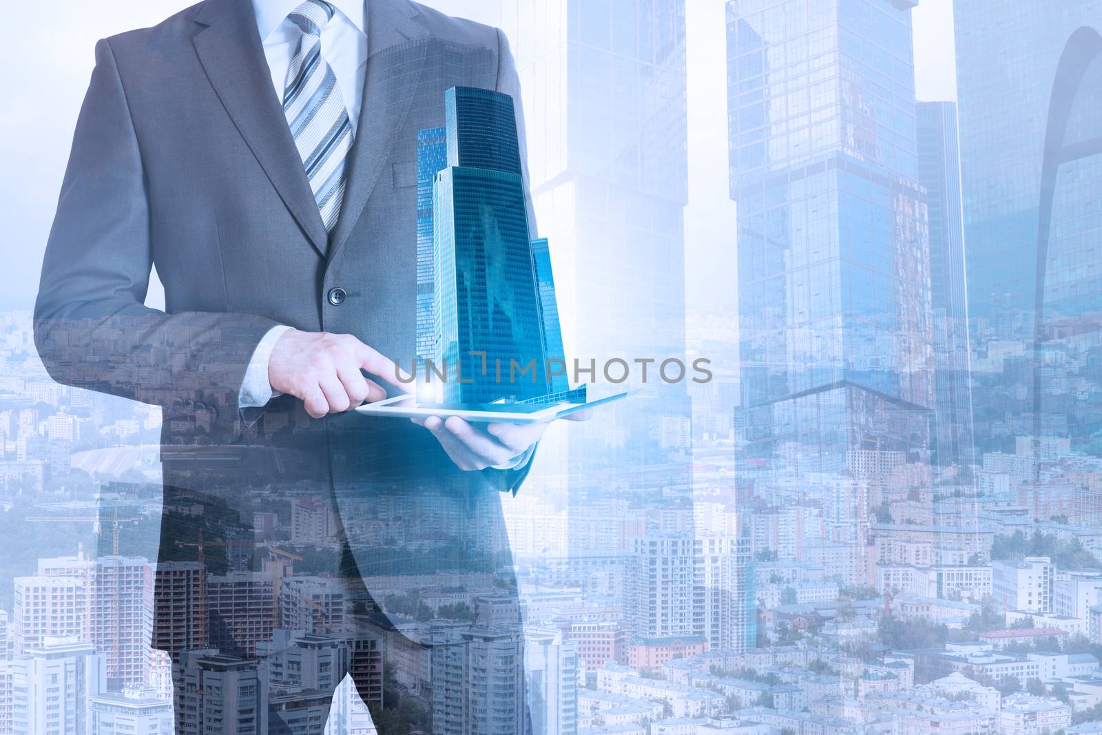 Businessman holding tablet with 3d city model on cityscape background