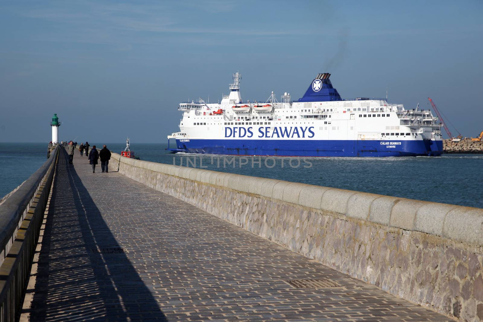 FRANCE, Calais: A ferry boat of the Danish company DFDS leaves the Calais harbour, northern France, on October 26, 2015. DFDS said on June 8, 2015 it had agreed to buy two ferries (Rodin and Berlioz) from rail tunnel operator Eurotunnel which was in partnership with MyFerryLink and had faced antitrust action in Britain over its Dover to Calais service. Eurotunnel said in May 2015 it would not renew contracts expiring on July 2 under which it leased three ferries it had acquired in 2012 from bankrupt maritime transporter SeaFrance to Scop SeaFrance, a cooperative of employee-owners of the re-baptised MyFerryLink line.