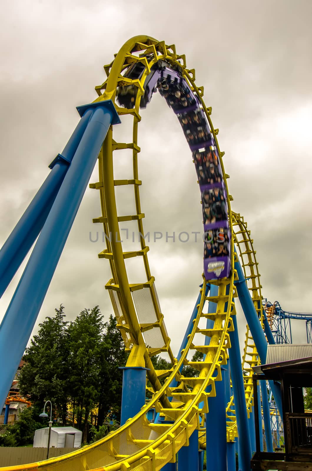 crazy rollercoaster rides at amusement park by digidreamgrafix