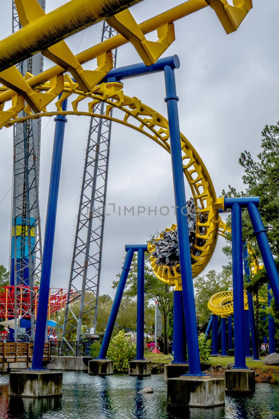 crazy rollercoaster rides at amusement park by digidreamgrafix