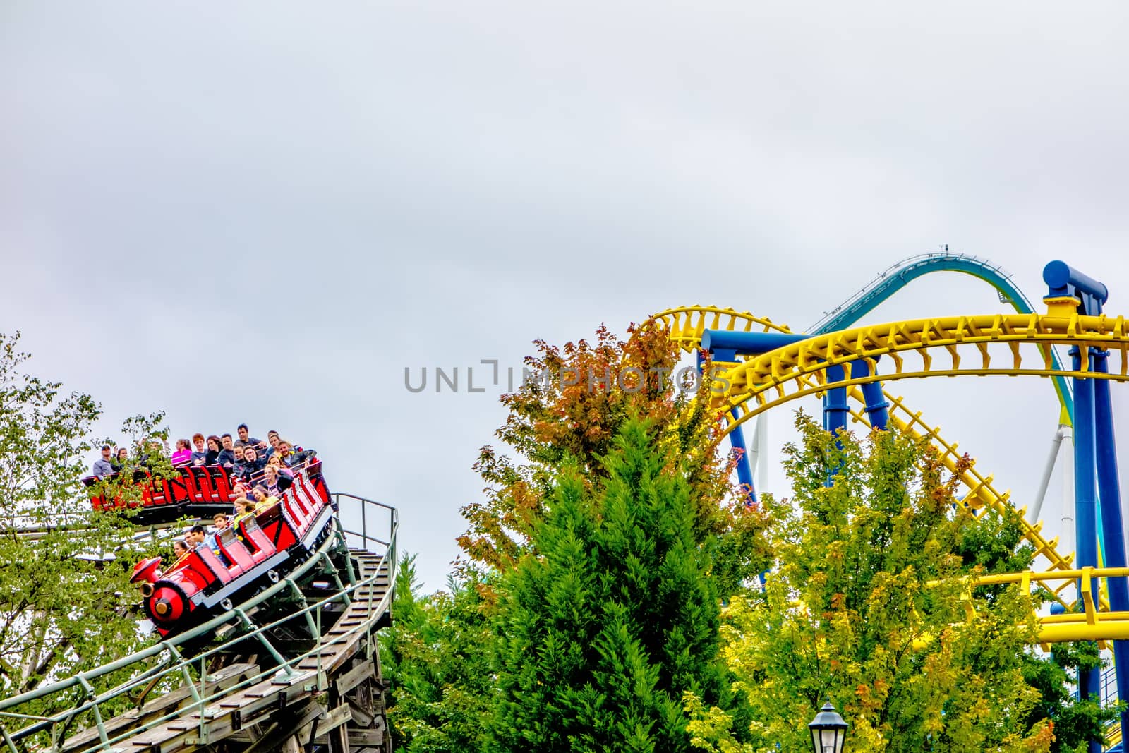 crazy rollercoaster rides at amusement park by digidreamgrafix