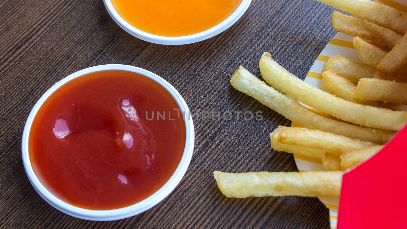 The eating fast food junk food on wood background