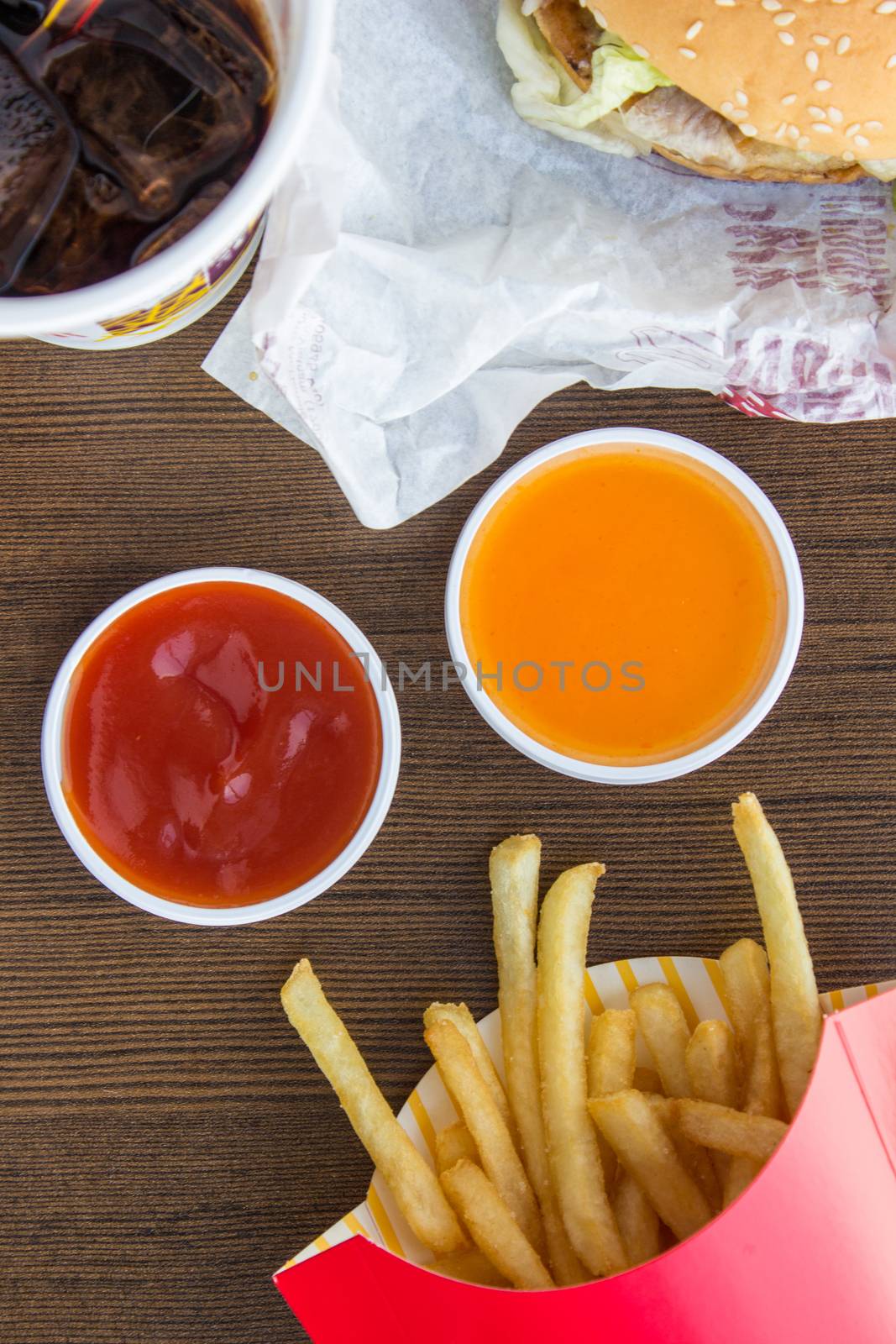 The eating fast food junk food on wood background