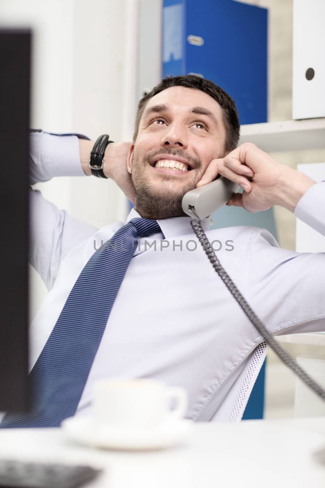 office, business, education, technology and internet concept - smiling businessman or student with computer and phone