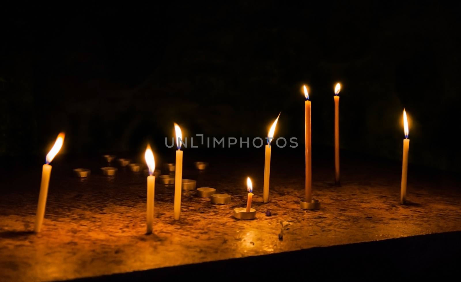 the dying candles in the church of the Holy Sepulchre 