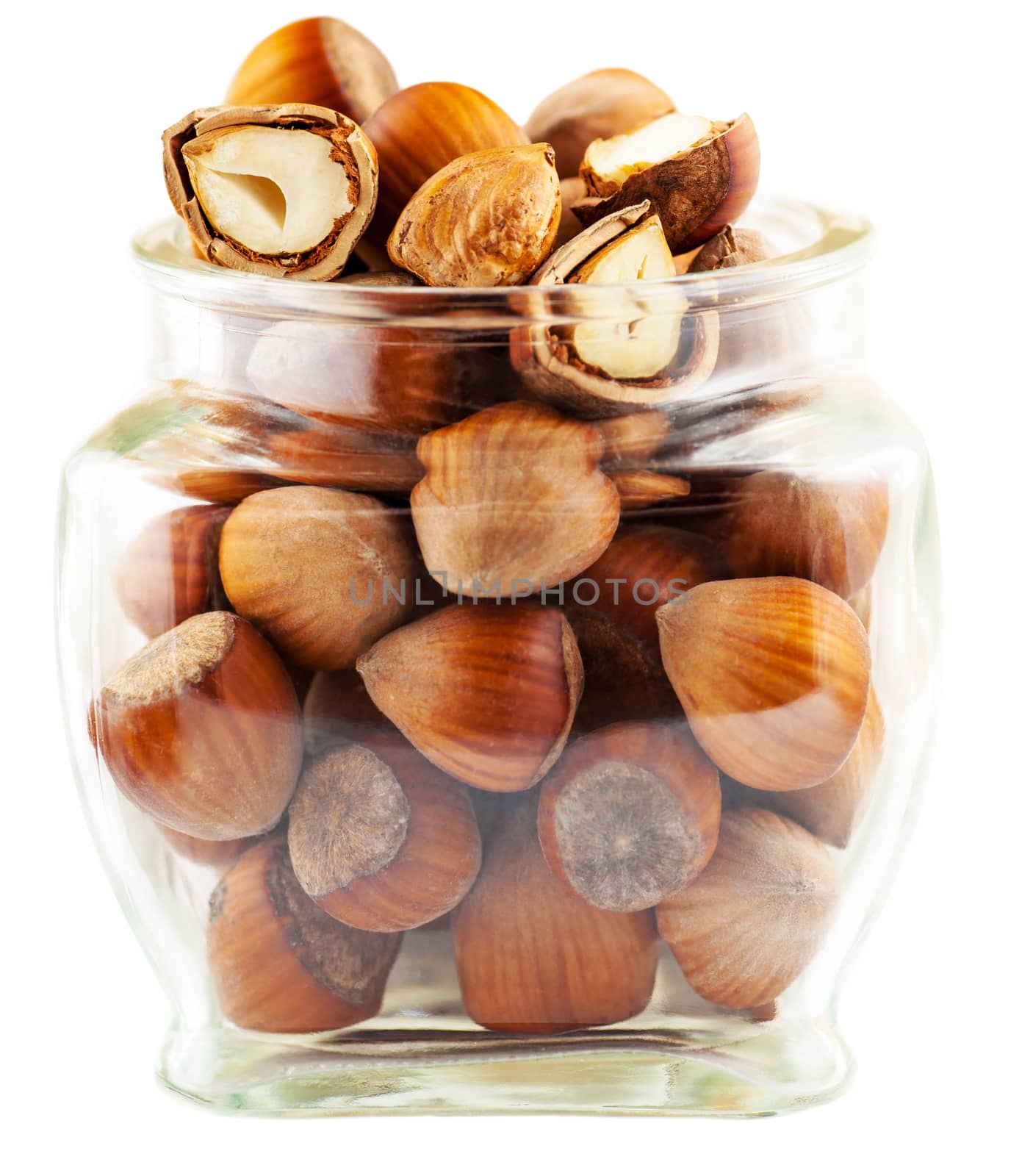 tree nuts in a glass jar isolated on white background
