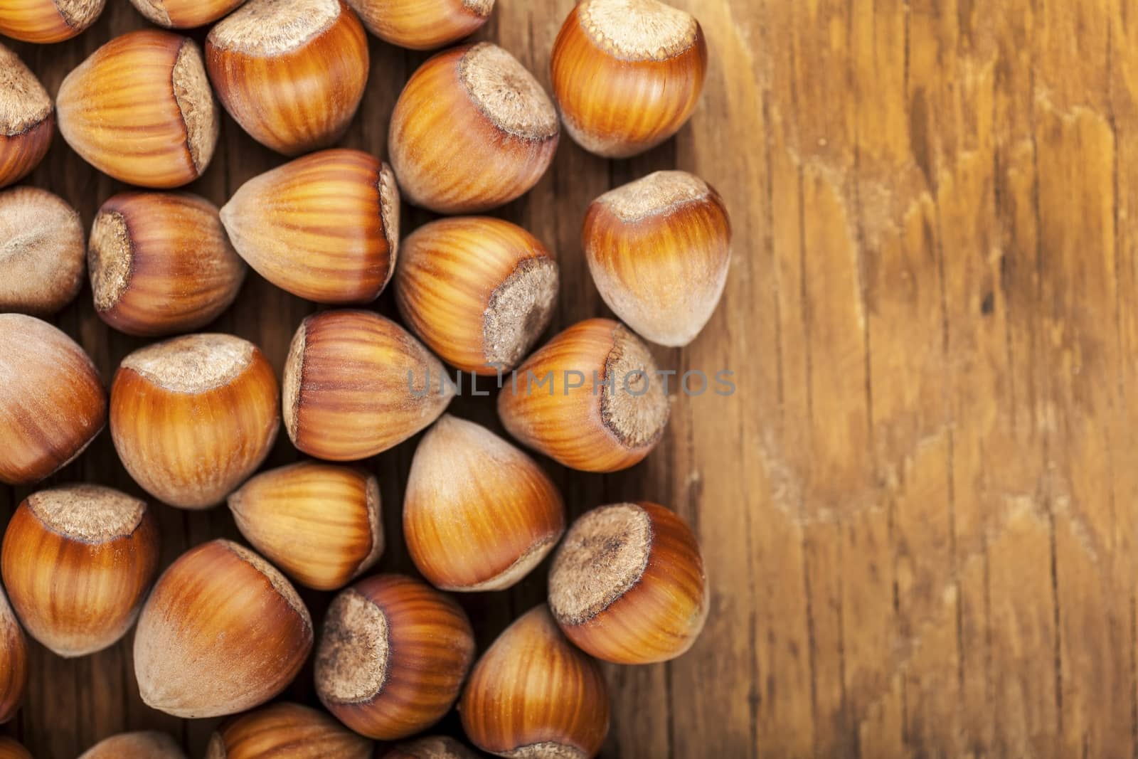  whole tree nuts close-up on wooden background