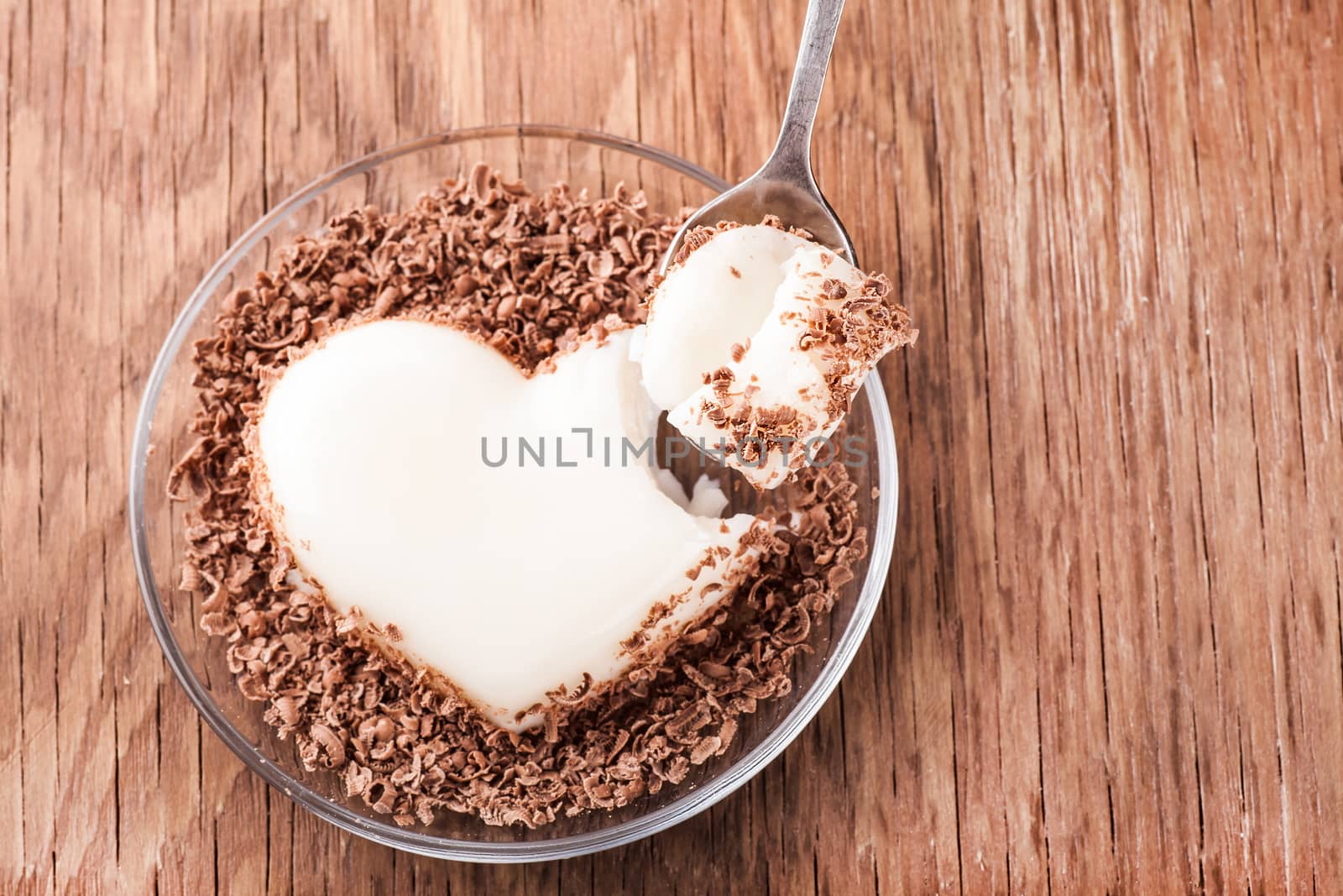 jelly crumb chocolate with a spoon on a wooden background