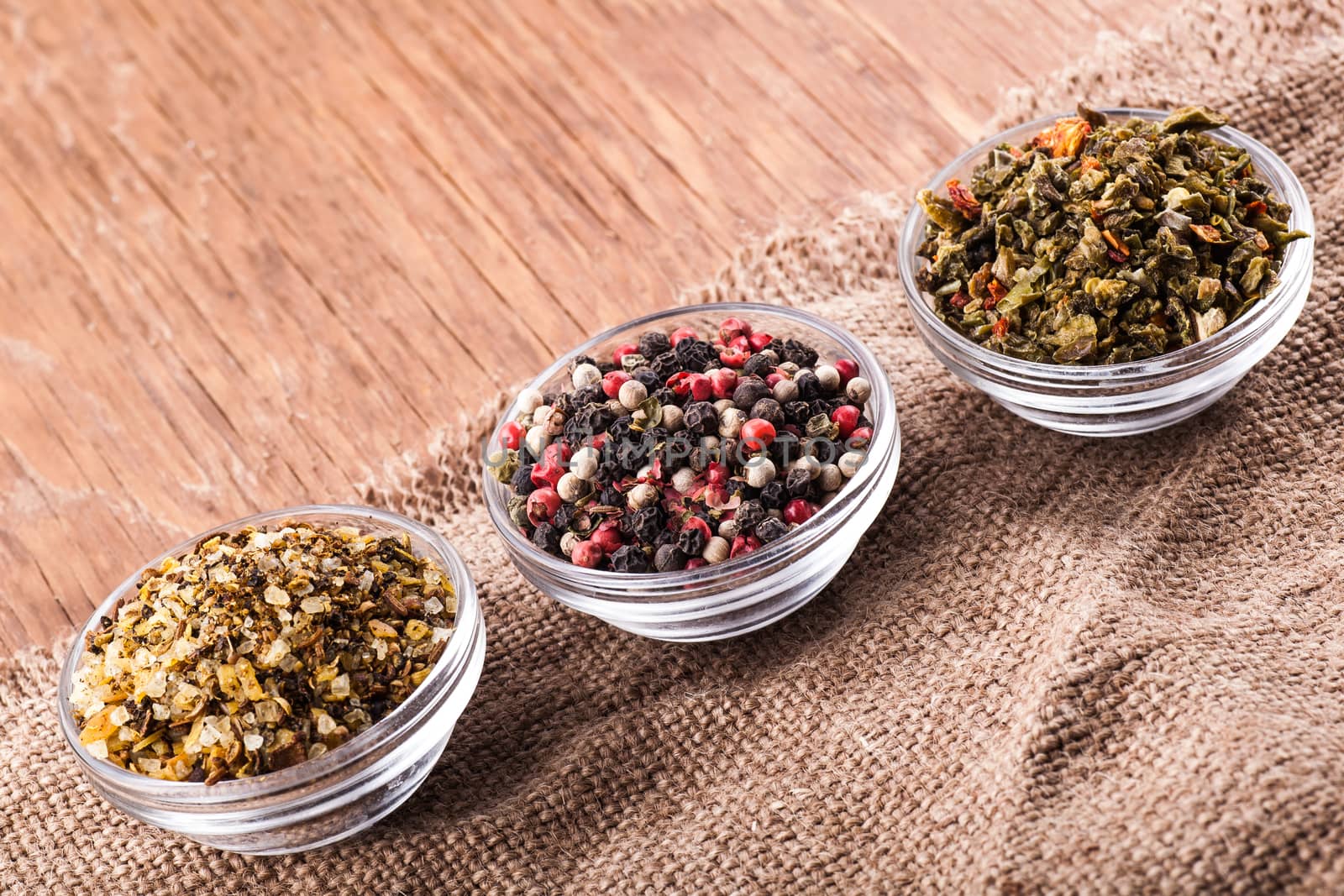 spices in a glass bowl on a vintage background