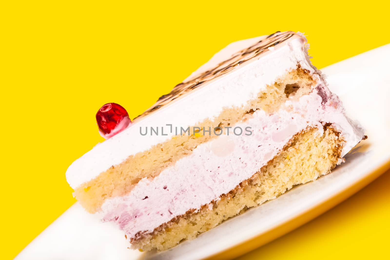 fresh of vanilla cake on a yellow background