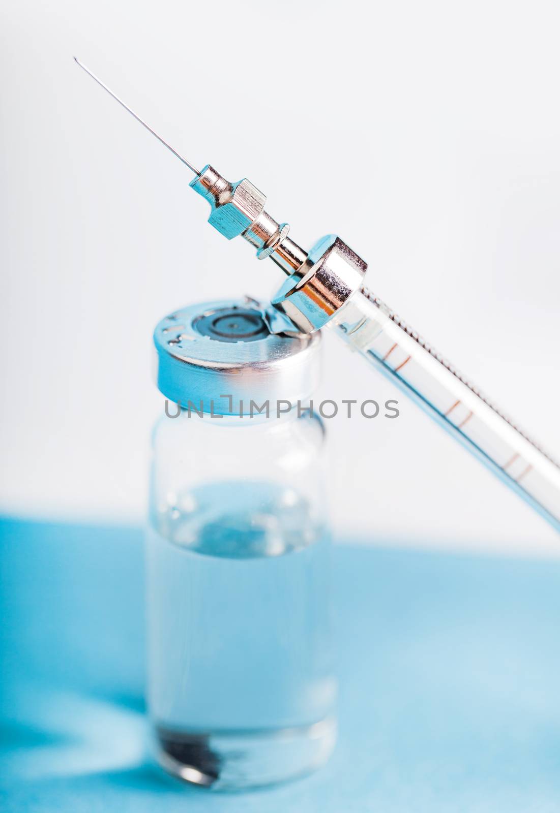 bottle of medicine and syringe  by MegaArt