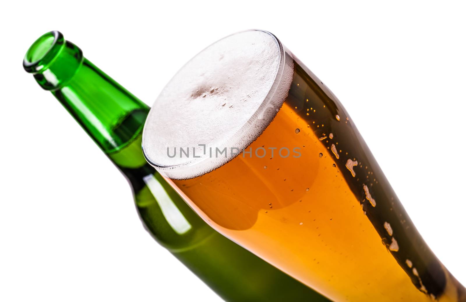 bottle and glass of light beer isolated on a white background
