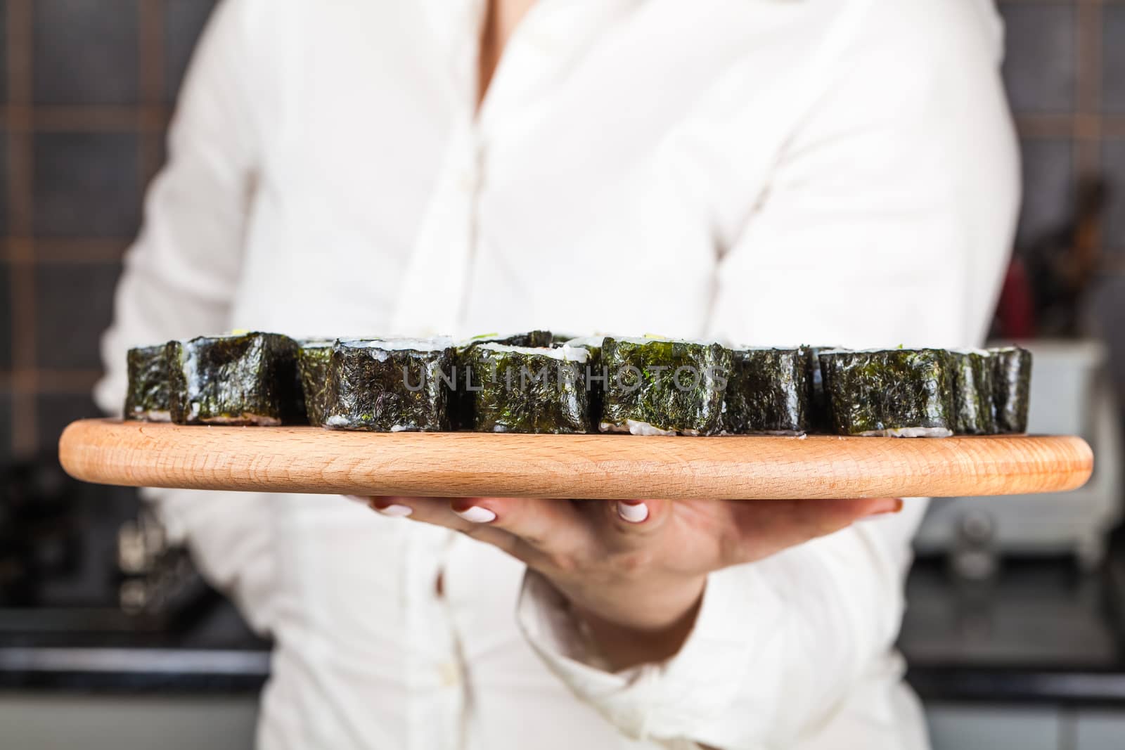 fresh sushi roll closeup on a wooden board