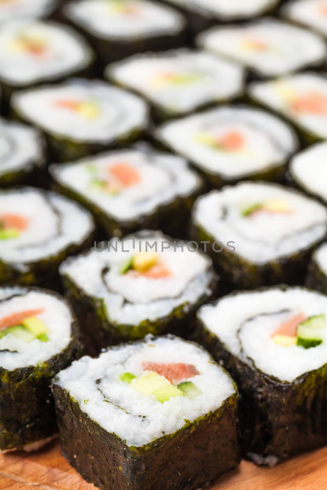 fresh sushi roll closeup on a wooden board