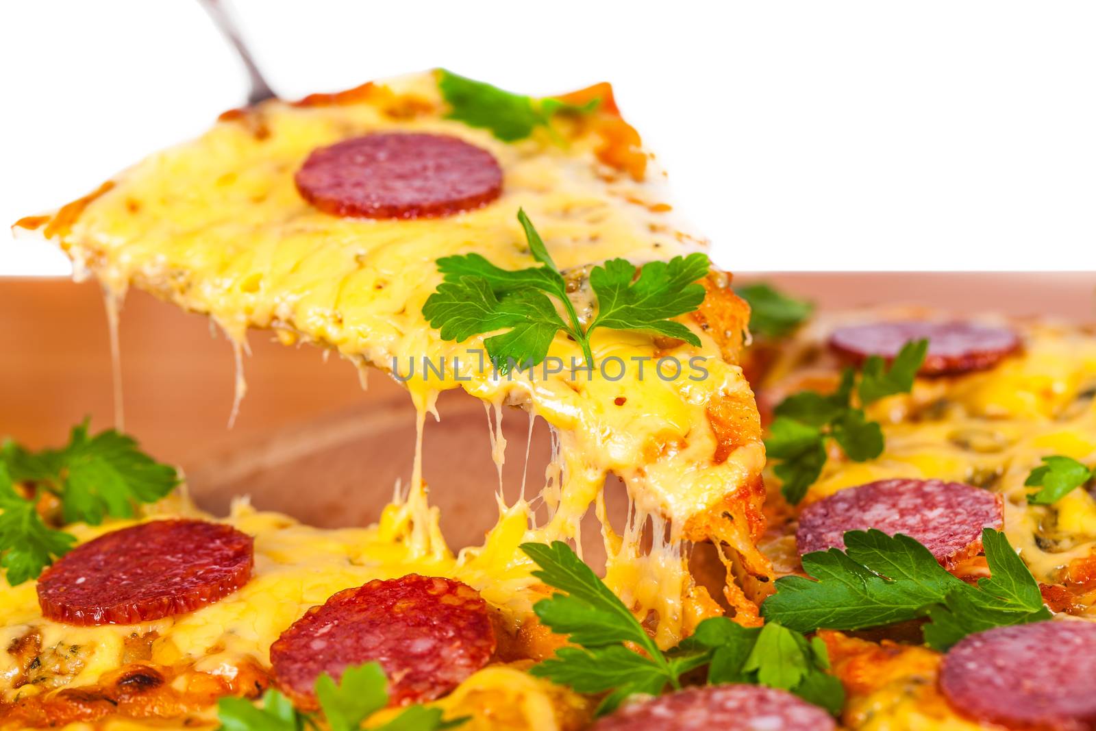 slice of pizza with cheese and salami closeup
