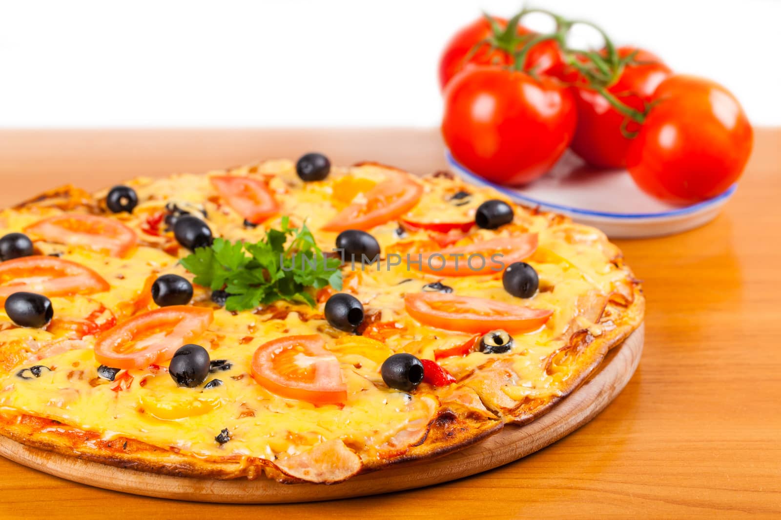 hot fresh a pizza with tomatoes on a wooden background