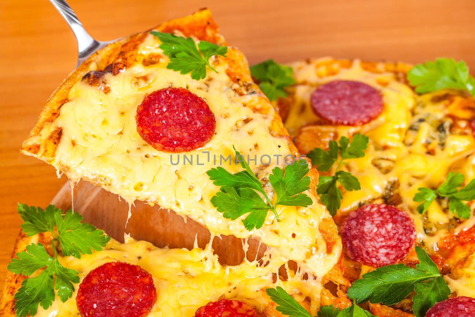 hot pizza with salami on wooden background