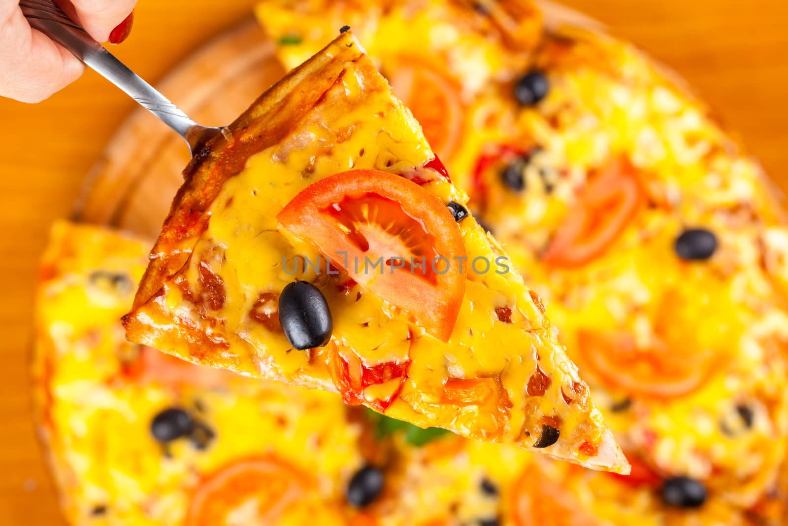 piece of fresh hot vegetable pizza closeup