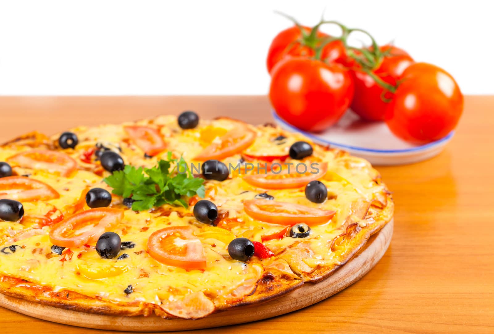 hot fresh a pizza with tomatoes on a wooden background