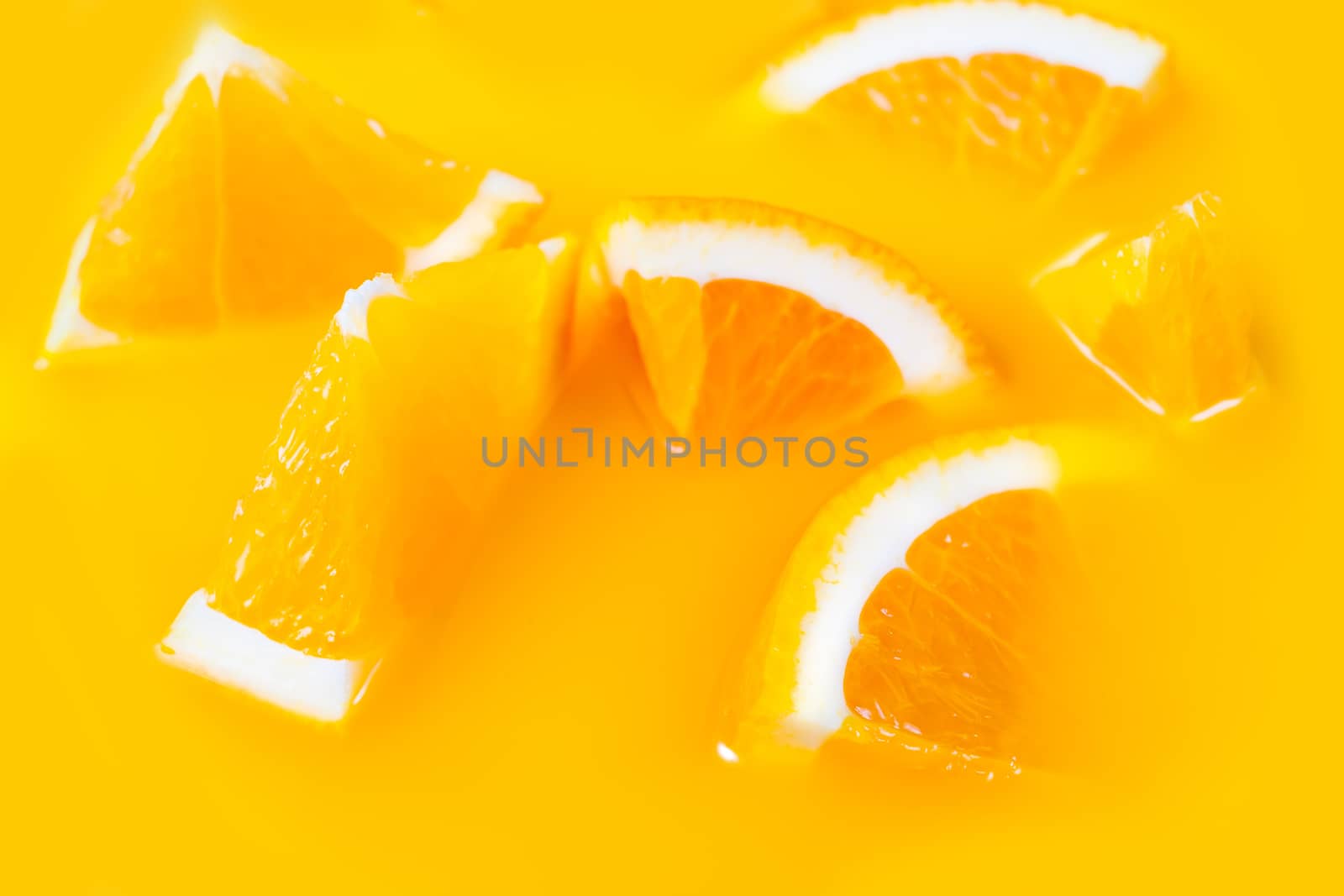 Many fresh a slice of orange on yellow background