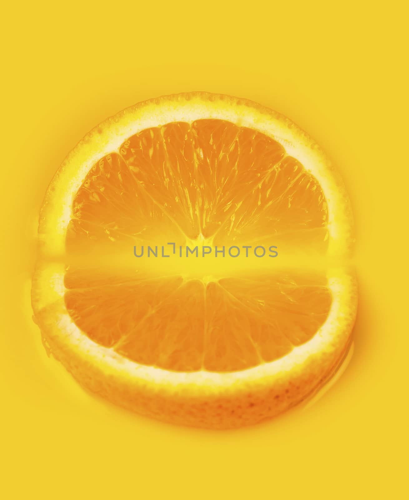 two slices of orange closeup lying in the juice