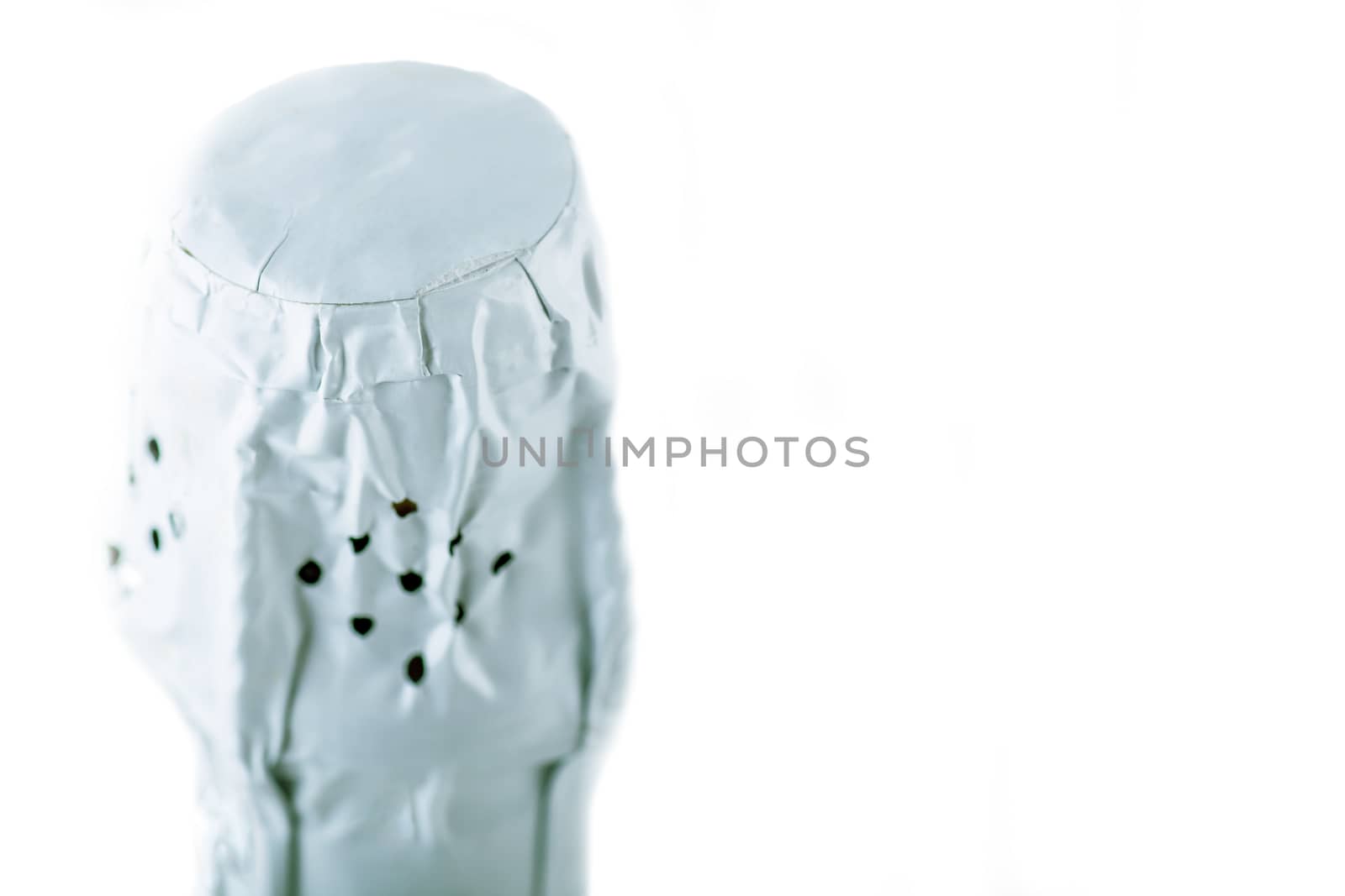 neck of a bottle of champagne closed foil on white isolated background