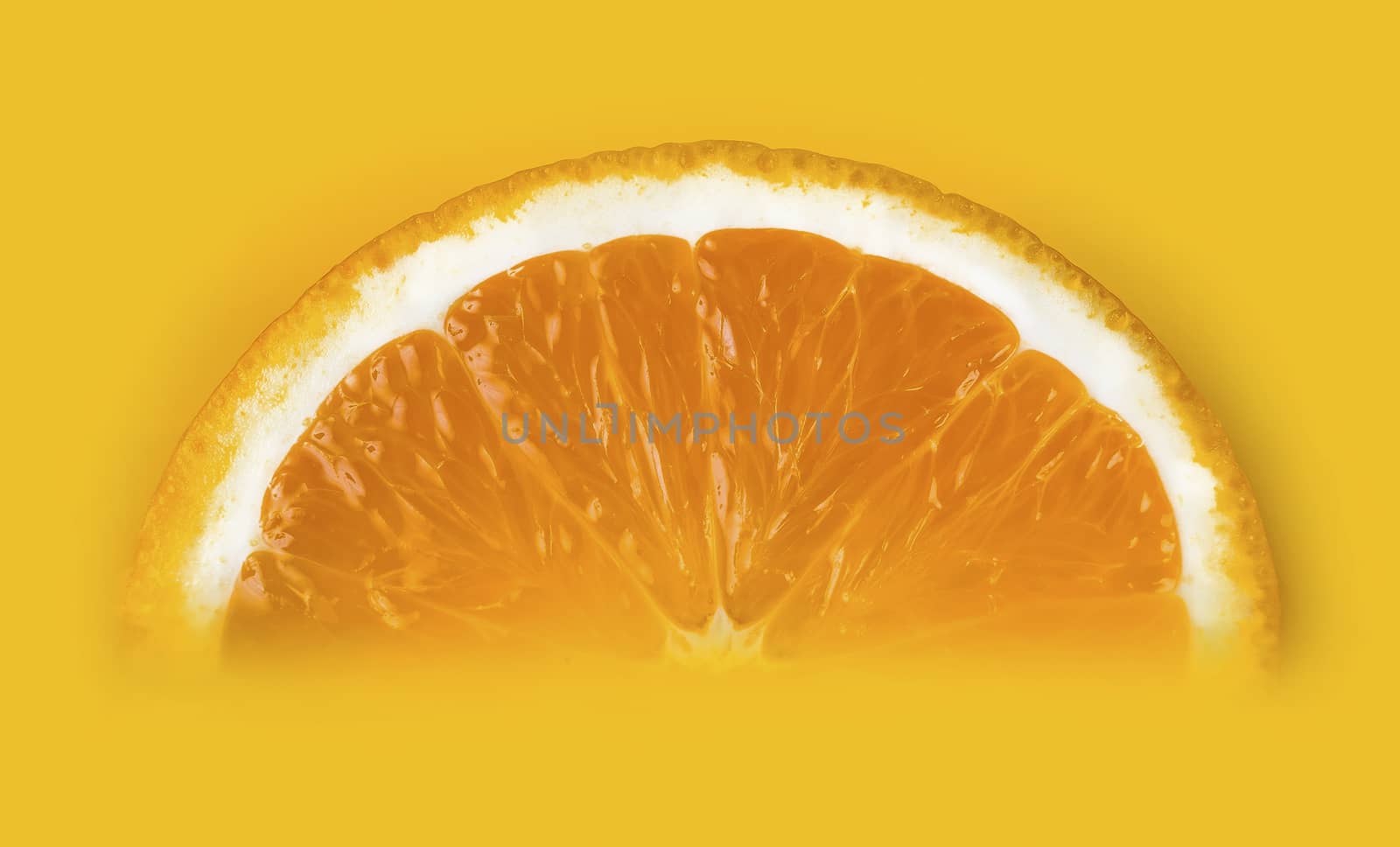  slice of orange close-up lying in the yellow juice