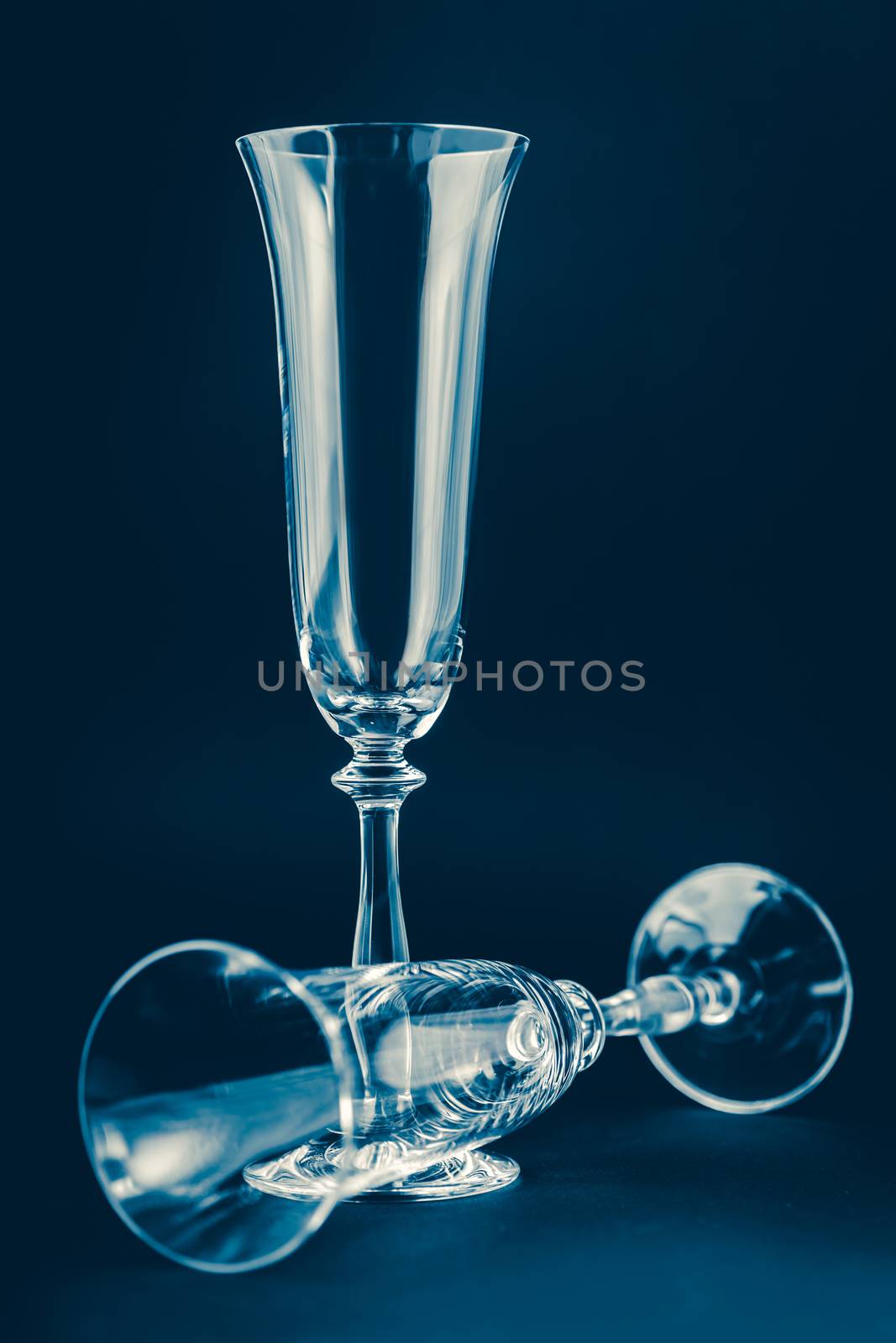 two empty glass cleaner on a dark background