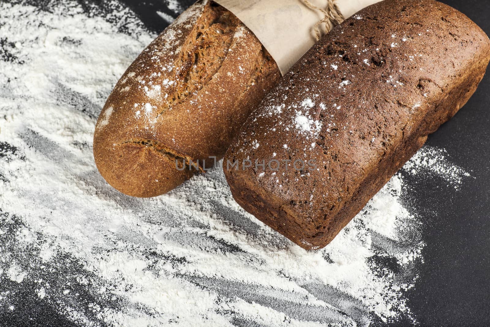 two rye bread on a dark background