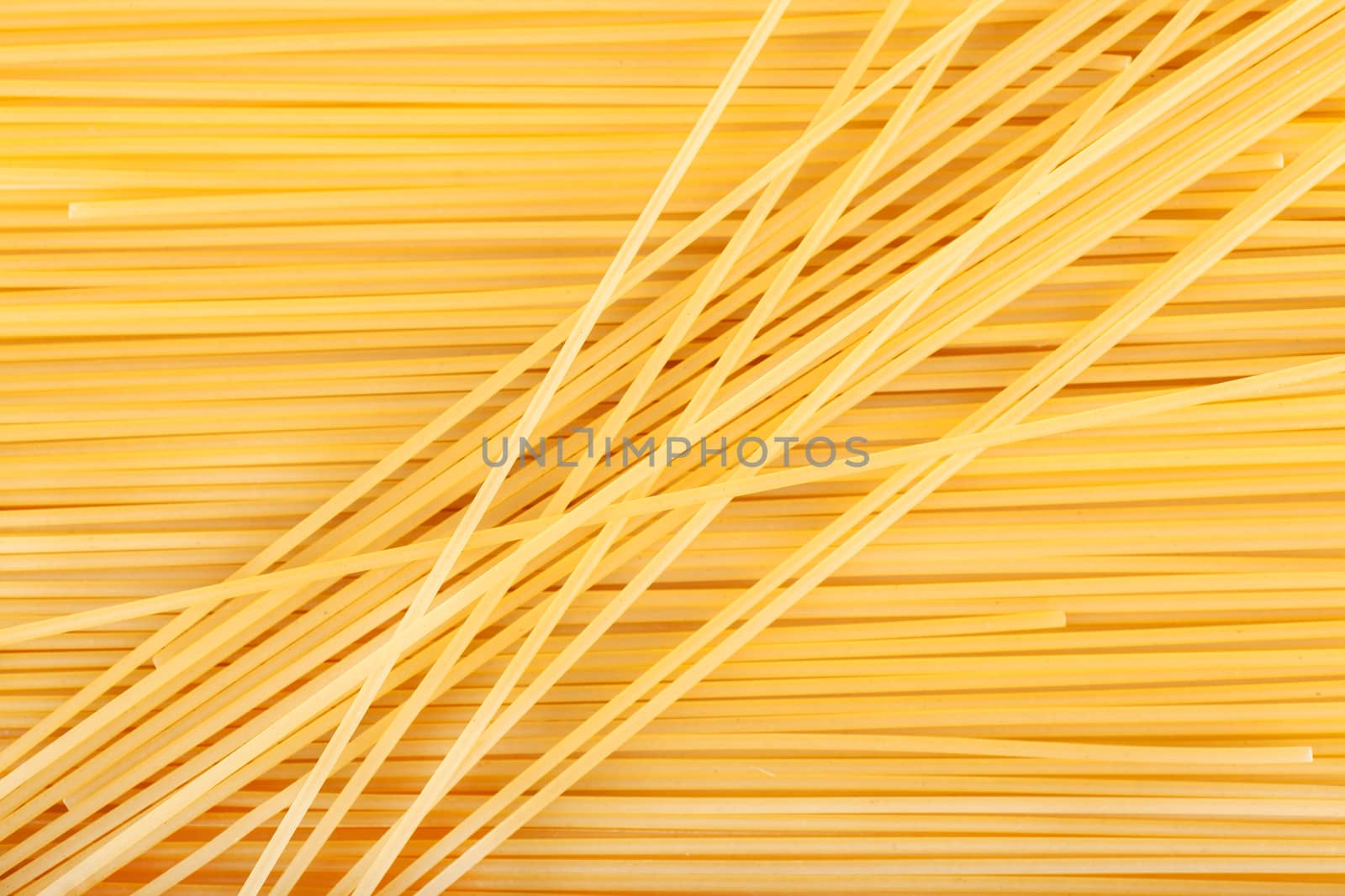 background raw pasta lined with diagonally and horizontally