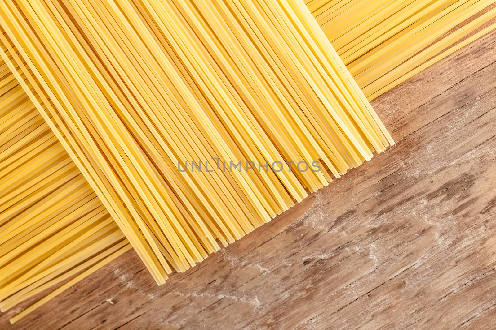 pasta posted on the a row on a wooden background