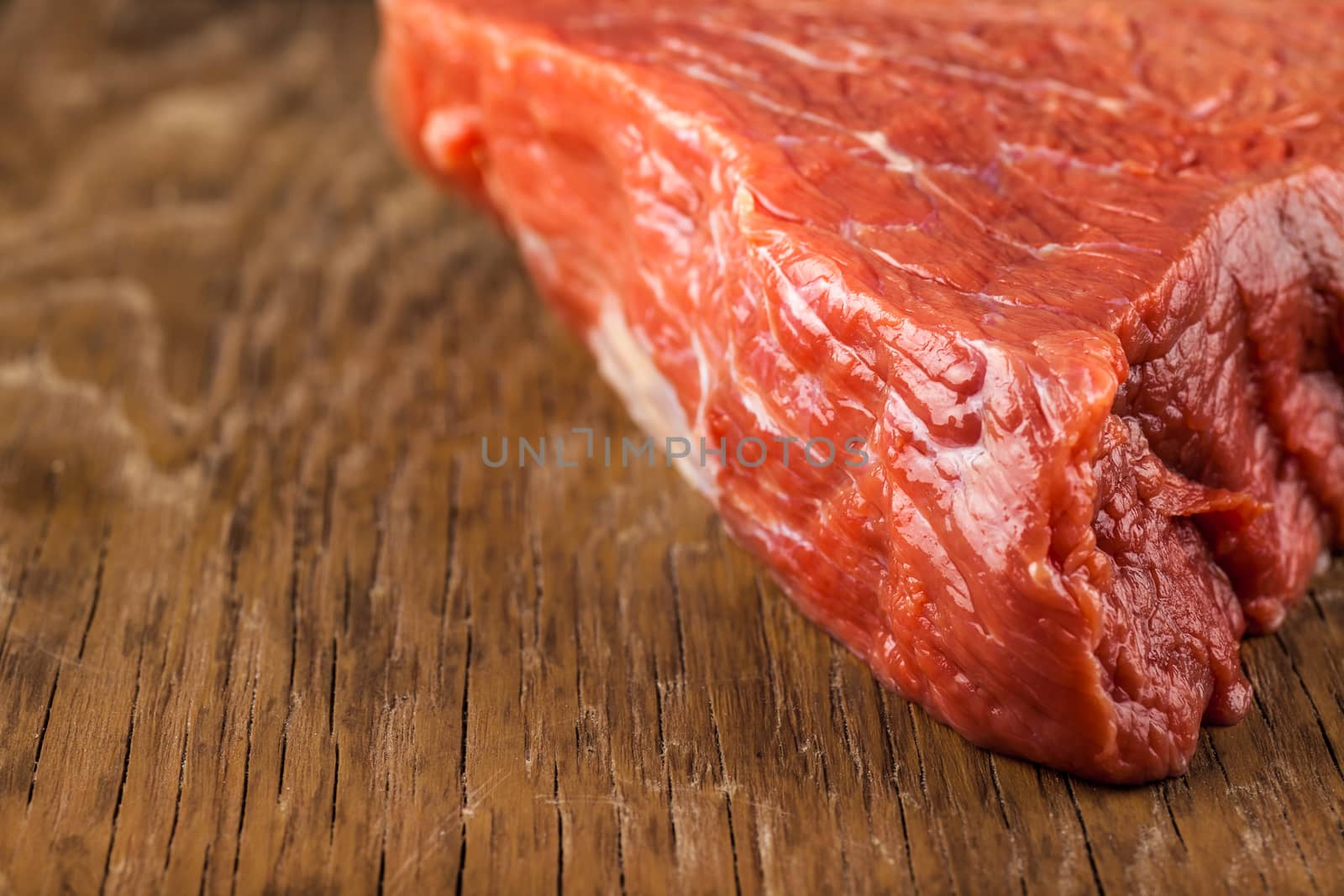 fillet of beef closeup on wooden background