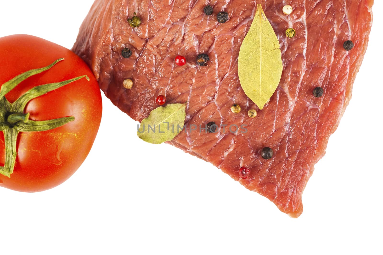 beef filet with spices and tomato, white background
