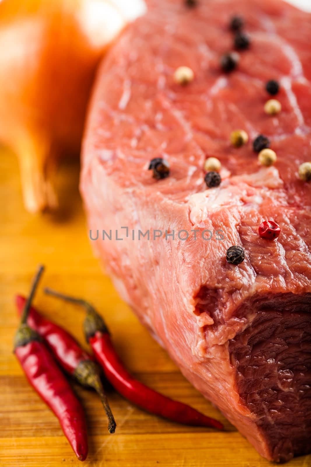 beef filet with spices and vegetables close-up 