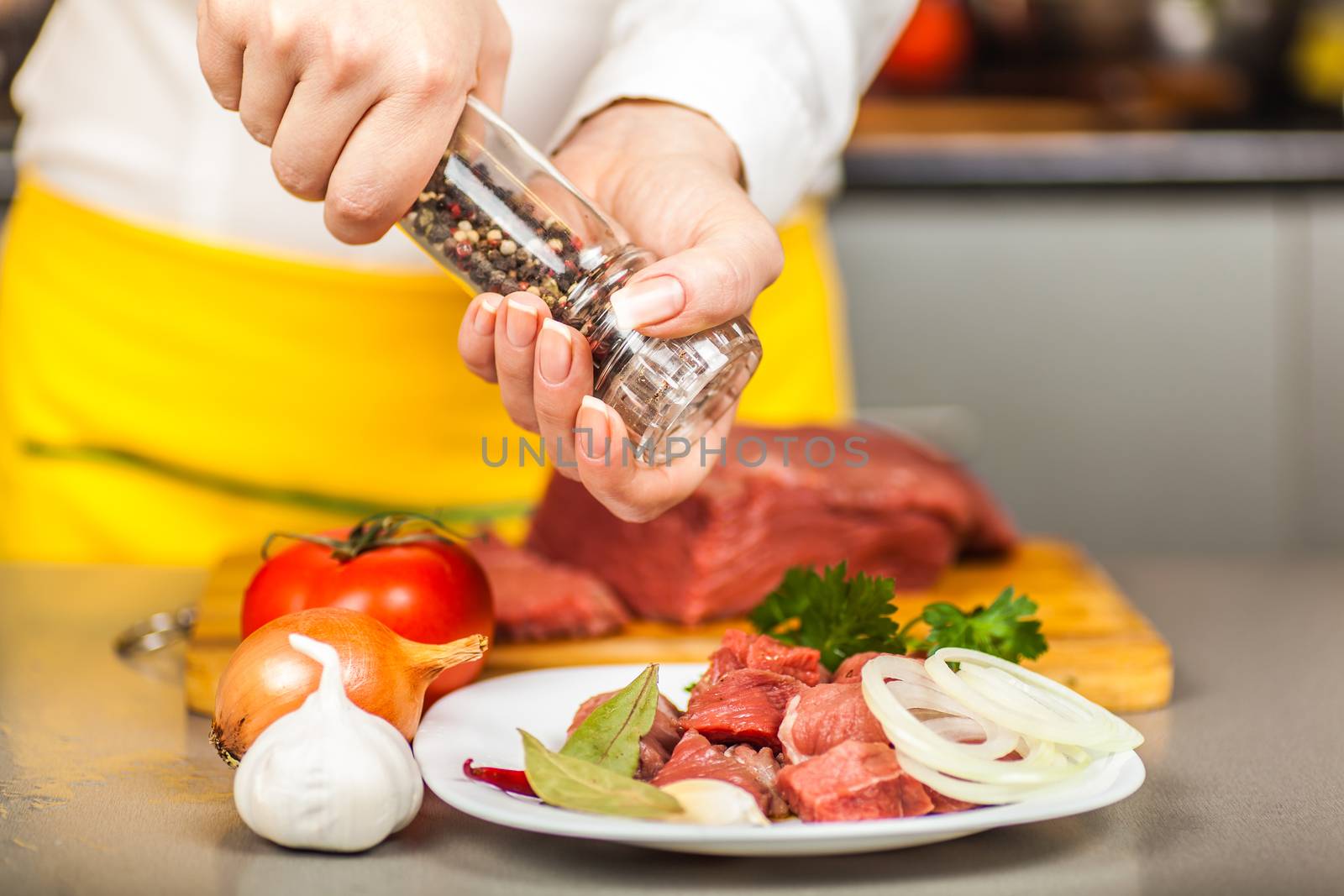 cook peppers beef fillet on a table spices and vegetables