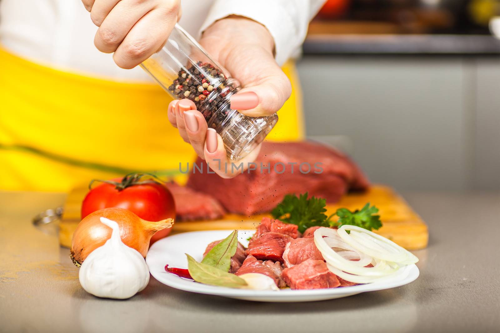 cook peppers meat fillet on a table spices and vegetables