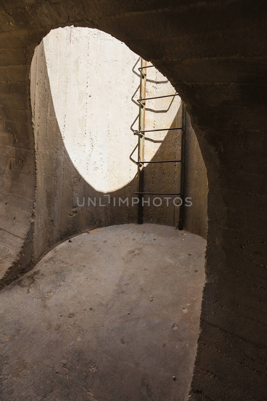 concrete structure monument with a hole and ladder