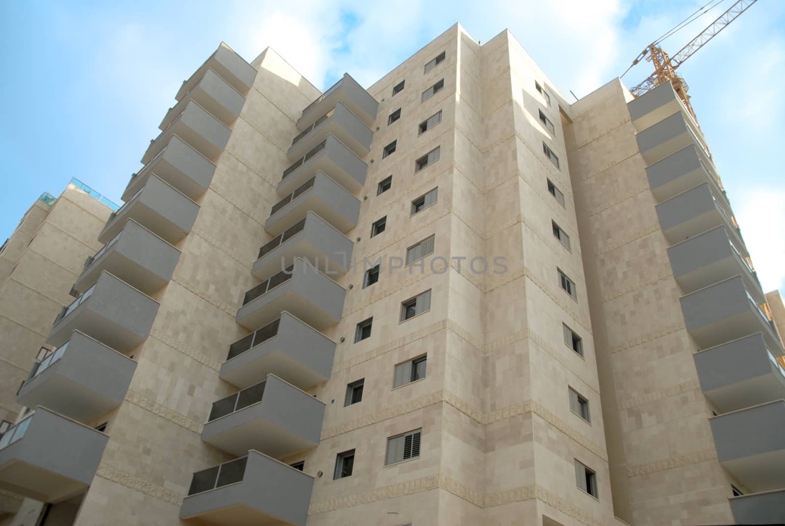 a new building under construction by day