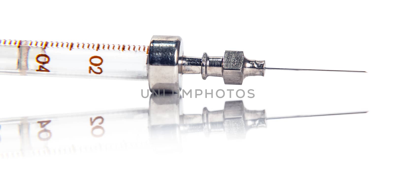Syringe with reflection on white background