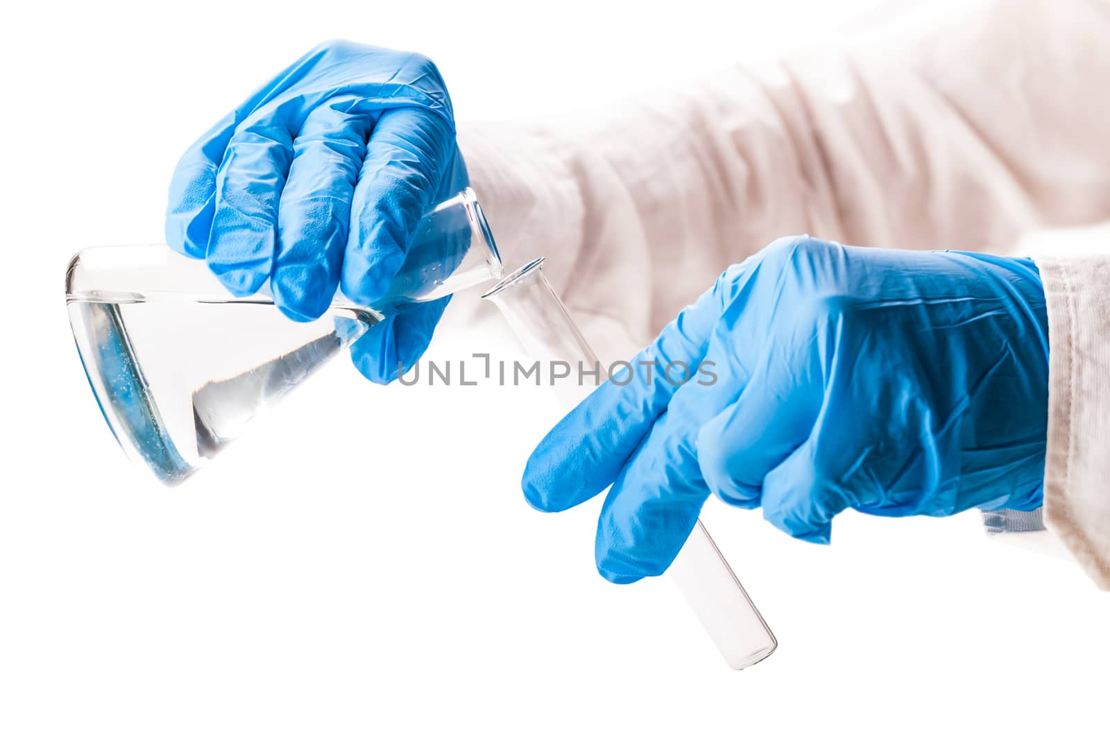 laboratorian reagent pouring on white isolated background